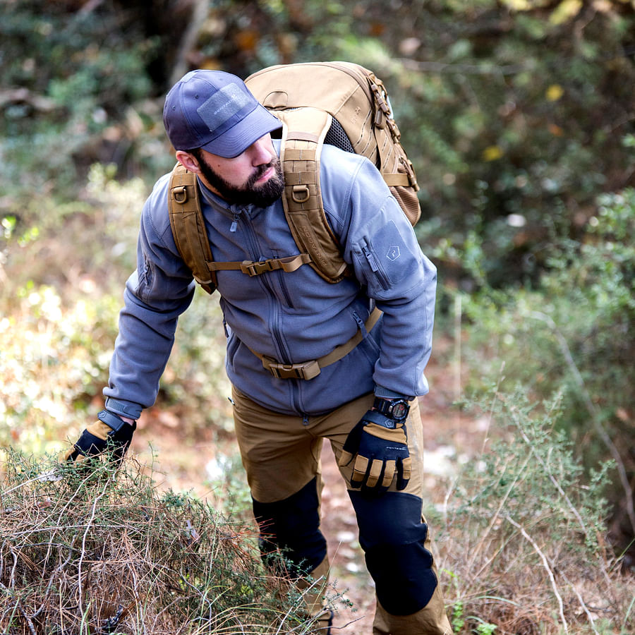 Backpacking stove set up on a scenic trail
