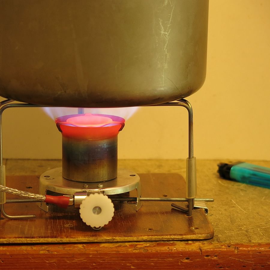 Close-up view of various components of a DIY backpacking stove